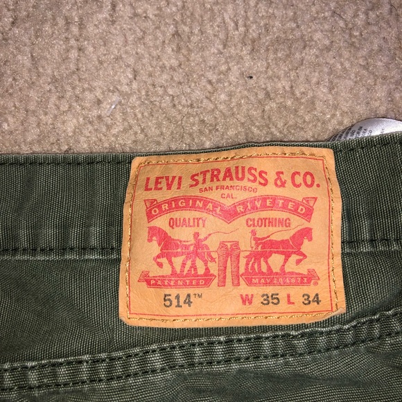 Faded olive green Levi jeans